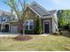 Well-kept home boasting stone details, green lawn, and welcoming front entrance at 150 Red Admiral Ct, Hillsborough, NC 27278