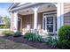 Relaxing front porch featuring rocking chairs and decorative plants at 150 Red Admiral Ct, Hillsborough, NC 27278