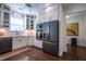 A well-lit kitchen with white cabinets, stainless steel appliances, and modern countertops at 150 Red Admiral Ct, Hillsborough, NC 27278