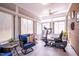 Inviting sunroom filled with natural light, featuring a comfortable chair and exercise equipment at 150 Red Admiral Ct, Hillsborough, NC 27278