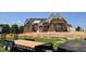 Exterior view of a brick home under construction with scaffolding at 154 Bellini Dr, Clayton, NC 27527
