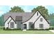 Charming painted brick home with gray roof, manicured landscaping, and inviting entryway at 154 Bellini Dr, Clayton, NC 27527