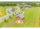 This aerial shot showcases the community amenities, including a park, pavilion, and parking at 1577 Wendell Valley Blvd, Wendell, NC 27591