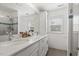 Modern bathroom featuring double sinks, a shower, and neutral color scheme at 2008 Reaves Dr, Raleigh, NC 27608