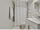 Cozy bathroom with white shower curtain, clean white fixtures and functional design at 2008 Reaves Dr, Raleigh, NC 27608