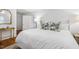 Bright bedroom with an accent rug, hardwood floors, and natural lighting at 2008 Reaves Dr, Raleigh, NC 27608