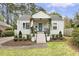 Charming home featuring a covered front porch, landscaped yard, and a tidy, inviting exterior at 2008 Reaves Dr, Raleigh, NC 27608
