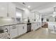 Beautiful kitchen with white cabinets, granite countertops, stainless steel appliances, and tile flooring at 2008 Reaves Dr, Raleigh, NC 27608