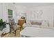 Comfortable living room with cozy seating, a natural fiber rug, and neutral decor throughout at 2008 Reaves Dr, Raleigh, NC 27608