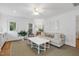 Inviting living room featuring hardwood floors, neutral decor, comfortable seating, and plenty of natural light at 2008 Reaves Dr, Raleigh, NC 27608