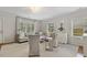Spacious living room with hardwood flooring, neutral-toned furniture, and ample natural light at 2008 Reaves Dr, Raleigh, NC 27608