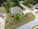 Charming home showcasing a well-manicured lawn and mature trees, captured from an aerial perspective at 201 Blue Heron Dr, Youngsville, NC 27596