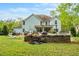 Spacious backyard with patio, outdoor kitchen, and a lush lawn at 201 Blue Heron Dr, Youngsville, NC 27596