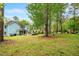 Expansive backyard featuring a covered patio and a built-in outdoor kitchen at 201 Blue Heron Dr, Youngsville, NC 27596