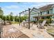 Spacious backyard with a pergola, outdoor seating, and a well-maintained lawn at 201 Blue Heron Dr, Youngsville, NC 27596