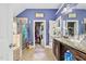 Well-lit bathroom featuring a glass-enclosed shower, granite countertop, and a peek into the closet at 201 Blue Heron Dr, Youngsville, NC 27596