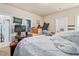 Cluttered bedroom featuring a television, exercise equipment, and personal items scattered around the room at 201 Blue Heron Dr, Youngsville, NC 27596