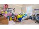 Bright bedroom with sloped ceilings, a cozy bed, and lots of storage space at 201 Blue Heron Dr, Youngsville, NC 27596