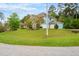 Side view of a blue two-story home with an attached three car garage at 201 Blue Heron Dr, Youngsville, NC 27596