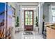 Bright foyer featuring tile flooring, a decorative door, and stylish accents at 201 Blue Heron Dr, Youngsville, NC 27596