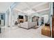 Inviting living room featuring marble floors, coffered ceilings, and an elegant chandelier at 201 Blue Heron Dr, Youngsville, NC 27596
