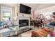 Cozy living room features a fireplace and an open layout, flowing into an adjoining space at 201 Blue Heron Dr, Youngsville, NC 27596