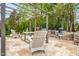 Outdoor kitchen with stainless steel grill and stone surround, perfect for entertaining at 201 Blue Heron Dr, Youngsville, NC 27596