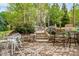 Beautiful outdoor patio area with stone steps and lush landscaping at 201 Blue Heron Dr, Youngsville, NC 27596