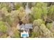 An aerial view of a private residence shows the sprawling home, pool, and verdant landscaping at 206 Zapata Ln, Chapel Hill, NC 27517