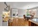 Bright dining area featuring hardwood floors and large windows overlooking backyard at 206 Zapata Ln, Chapel Hill, NC 27517