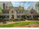 Charming two-story home with manicured lawn, brick walkway, dormer windows and dark shutters at 206 Zapata Ln, Chapel Hill, NC 27517