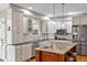 Modern kitchen with stainless steel appliances, granite countertops, and custom cabinetry at 206 Zapata Ln, Chapel Hill, NC 27517