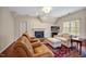 Inviting living room features a fireplace, hardwood floors, and lots of natural light at 206 Zapata Ln, Chapel Hill, NC 27517
