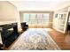 Comfortable living room with hardwood floors, a fireplace, a large area rug and natural light at 206 Zapata Ln, Chapel Hill, NC 27517