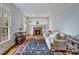 Cozy living room featuring a fireplace, hardwood floors, and a comfortable sofa at 206 Zapata Ln, Chapel Hill, NC 27517