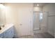 Bathroom featuring a glass door shower and vanity with light fixtures at 21 Shoreline Dr, Lillington, NC 27546