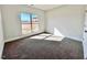 Bedroom showcasing a large window for natural light and neutral carpeting at 21 Shoreline Dr, Lillington, NC 27546