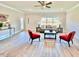 Bright living room featuring modern furniture, light wood floors, and a view to the outside at 21 Shoreline Dr, Lillington, NC 27546