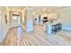 Spacious open-concept area with a light-filled kitchen, dining area, and modern flooring at 21 Shoreline Dr, Lillington, NC 27546
