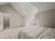 Bright bedroom boasts a large window, soft carpet and a neutral color palette at 2102 Trailridge Ct, Raleigh, NC 27603