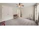 Cozy bedroom with plush carpeting, ceiling fan, closet and a simple decor for comfort and functionality at 2102 Trailridge Ct, Raleigh, NC 27603