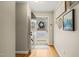 Inviting entryway with hardwood floors, neutral walls, and views of the front door with a decorative wreath at 2102 Trailridge Ct, Raleigh, NC 27603