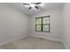 Neutral bedroom with plush carpet and natural light at 2204 Secluded Oaks Ct, Wake Forest, NC 27587