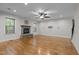 Inviting living room features a cozy fireplace and hardwood floors at 2204 Secluded Oaks Ct, Wake Forest, NC 27587