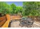 Inviting deck space with bench seating offers peaceful views of the surrounding trees at 2416 W Club Blvd, Durham, NC 27705