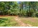 Large, level backyard provides ample space for outdoor activities and recreation at 2416 W Club Blvd, Durham, NC 27705