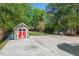 Spacious backyard with a shed, grilling area, and a concrete patio, perfect for entertaining at 2416 W Club Blvd, Durham, NC 27705