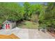 Large backyard featuring a storage shed and BBQ grill with patio area at 2416 W Club Blvd, Durham, NC 27705
