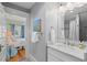 Bathroom with marble countertops and a peek into the connecting bedroom at 2416 W Club Blvd, Durham, NC 27705