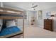 Well-lit bedroom featuring bunk beds and a classic wooden dresser at 2416 W Club Blvd, Durham, NC 27705